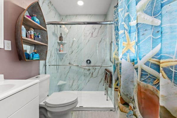 Sustainable bathroom design with water-saving fixtures, reclaimed materials, and eco-friendly features